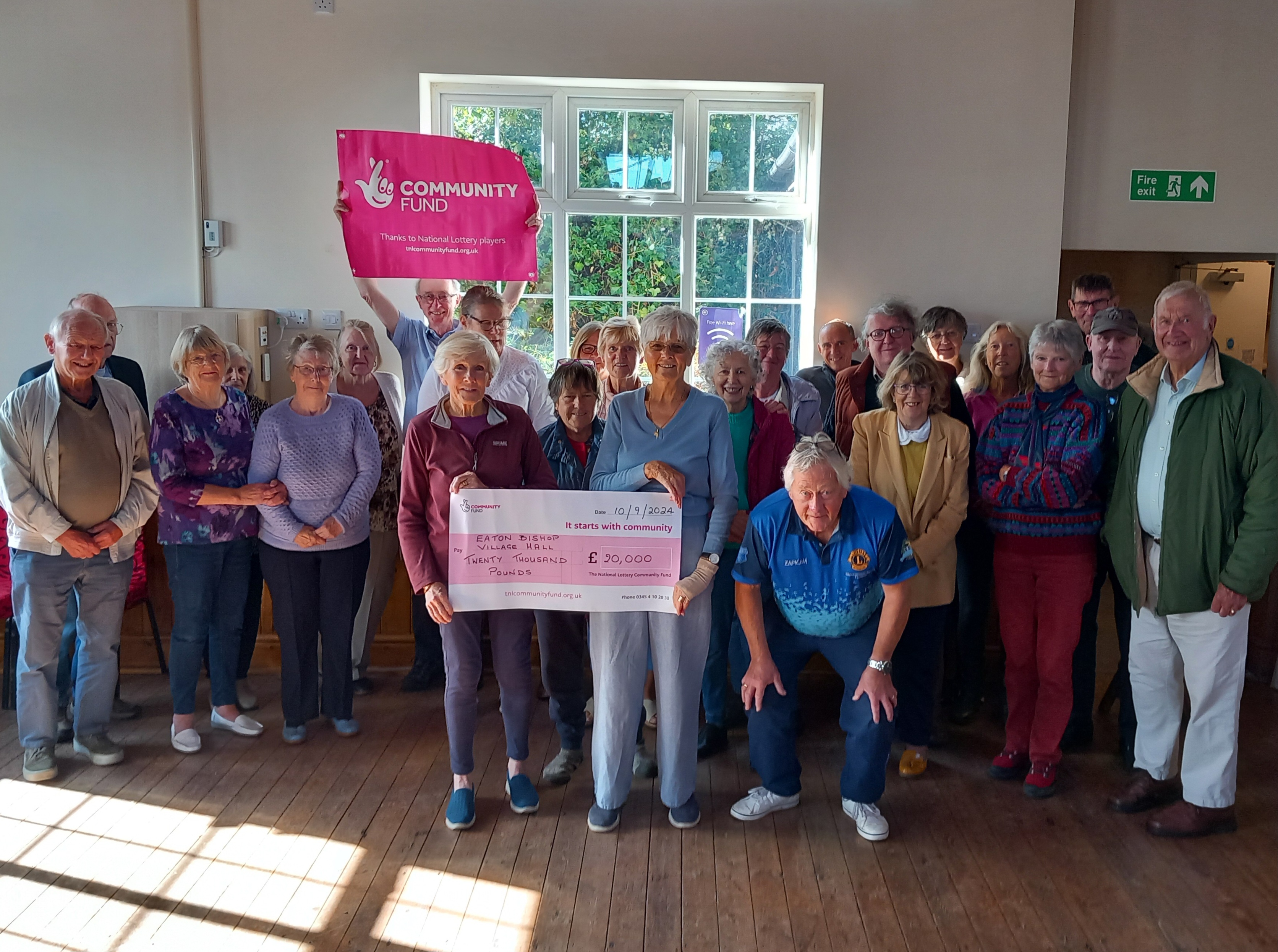 Supportive members with National Lottery Cheque 2024
